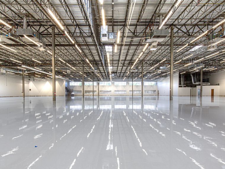 Warehouse with a freshly laid glossy epoxy floor